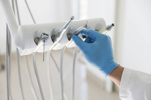 Professional Tooth Extraction technician working in Charlestown, IN